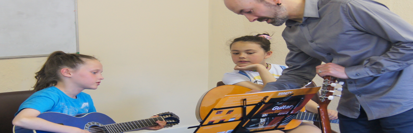 Children playing guitar
