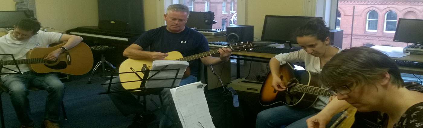 Adult guitar class